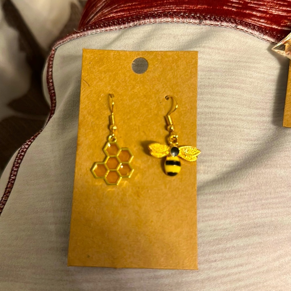 - Adorable honeycomb and bee mismatched earrings